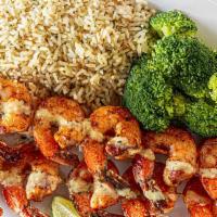 Island Grilled Shrimp · Grilled shrimp skewers are perfectly seasoned in a smoky mesquite rub, drizzled in garlic pa...
