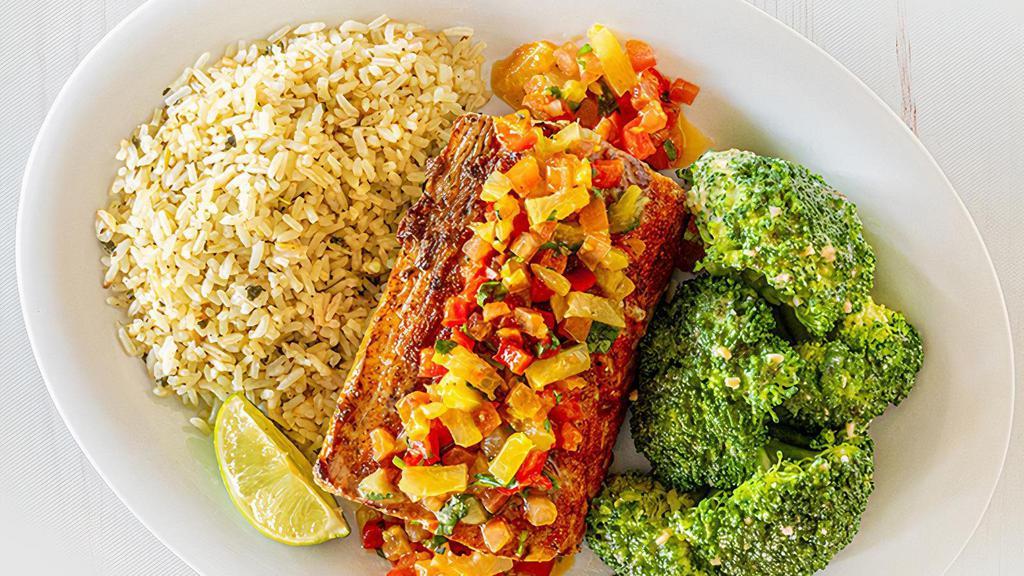 Tropical Mahi Mahi · Mahi mahi is blackened and topped with pineapple red pepper salsa, garnished with cilantro. Served with two sides. (600-1140 cal.)
