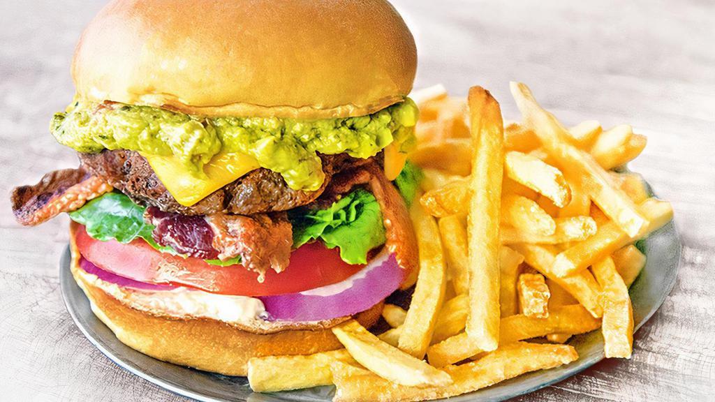 Bacon Guacamole Burger · Our signature burger topped with crispy bacon, American cheese, house-made guacamole, tomato, lettuce, onion and mayo on brioche bun. Served with a side item. (1410-1680 cal.)
