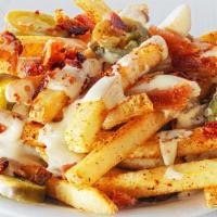 Side Bacon Jalapeño Cheese Fries · Our natural cut fries tossed in a spicy seasoning, smothered in warm queso, topped with crum...