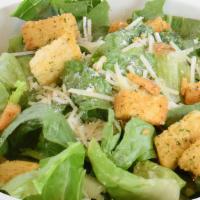 Side Caesar Side Salad · Crisp chopped Romaine lettuce tossed in creamy Caesar dressing, topped with croutons and Par...