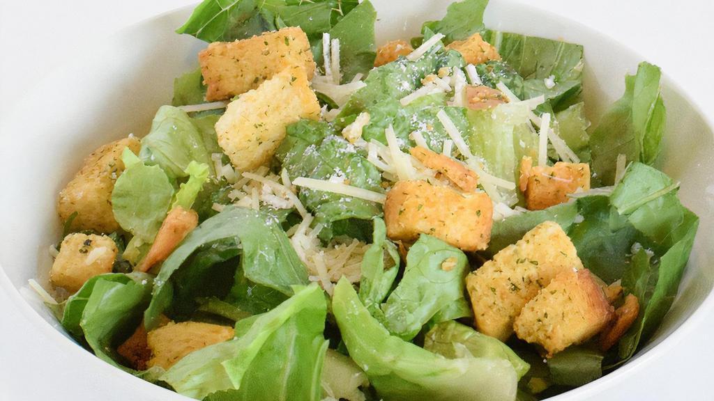 Side Caesar Side Salad · Crisp chopped Romaine lettuce tossed in creamy Caesar dressing, topped with croutons and Parmesan cheese. (450 cal)