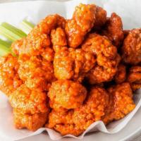 50 Boneless Wings · 50 Boneless Wings tossed in your choice of up to 4 sauces.  Served with celery and ranch or ...