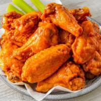 50 Jumbo Bone-In Wings · 50 Jumbo Bone-In Wings tossed in your choice of up to 4 sauces.  Served with celery and ranc...