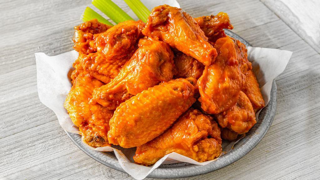 50 Jumbo Bone-In Wings · 50 Jumbo Bone-In Wings tossed in your choice of up to 4 sauces.  Served with celery and ranch or bleu cheese dressing for dipping.  (5200-9880 cal)