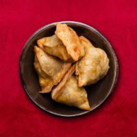 Solo Samosa · Triangular shaped flaky pastry filled with spicy potato usually served with a side of chutney.