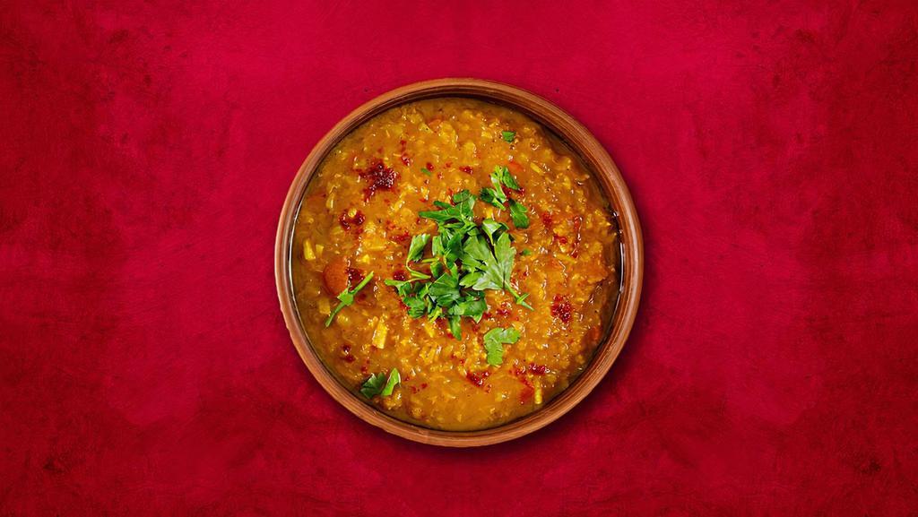 Central Dal Tadka · Yellow lentil cooked in high flame with Indian spices and ingredients with the touch of butter.