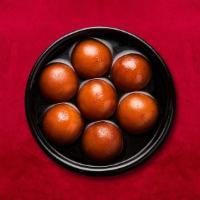 Central Gulab Jamun · Soft dumplings made of milk solid and flour and soaked in flavored sugar syrup.