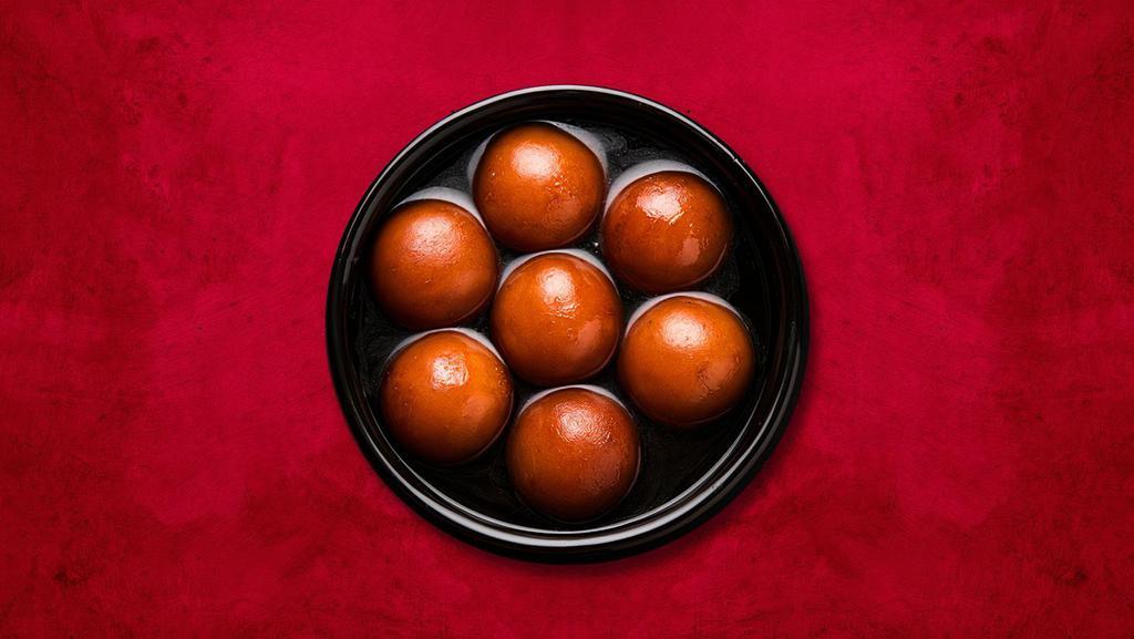 Central Gulab Jamun · Soft dumplings made of milk solid and flour and soaked in flavored sugar syrup.
