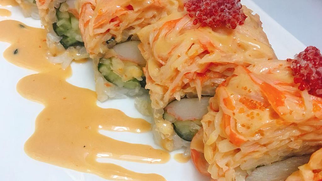 Dragon Roll · Eel, cucumber with avocado and masago on top.