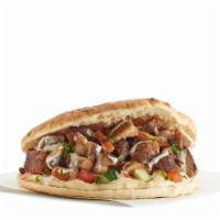 Grilled Chicken Sandwich · Grilled chicken thighs with our signature shawarma spices. Pita with a spread of hummus and ...