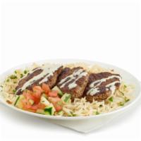 Lamb Kofta Rice (Standard) · Grilled lamb patty with onions, parsley, mint, and spices. Basmati rice, scoop of salad (tom...