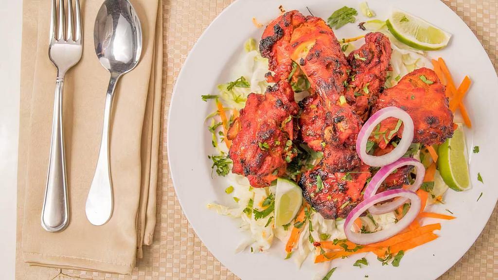 Tandoori Chicken · Gluten free. Chicken marinated in yogurt blended with fresh ginger, garlic, herbs, spices overnight and then cooked in a clay oven.