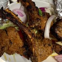 Lamb Chops · Seasoned Lamb meat with bone, marinated with chef's special sauce and grilled..Good 4 Peice