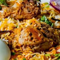 Goat Dum Biryani · Spicy, gluten free. Basmati rice cooked with goat meat, herbs, spices and garnished with oni...