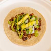 Al Pastor Taco · Served on fresh soft corn or flour tortilla, finished with freshly cut white onions, cilantr...