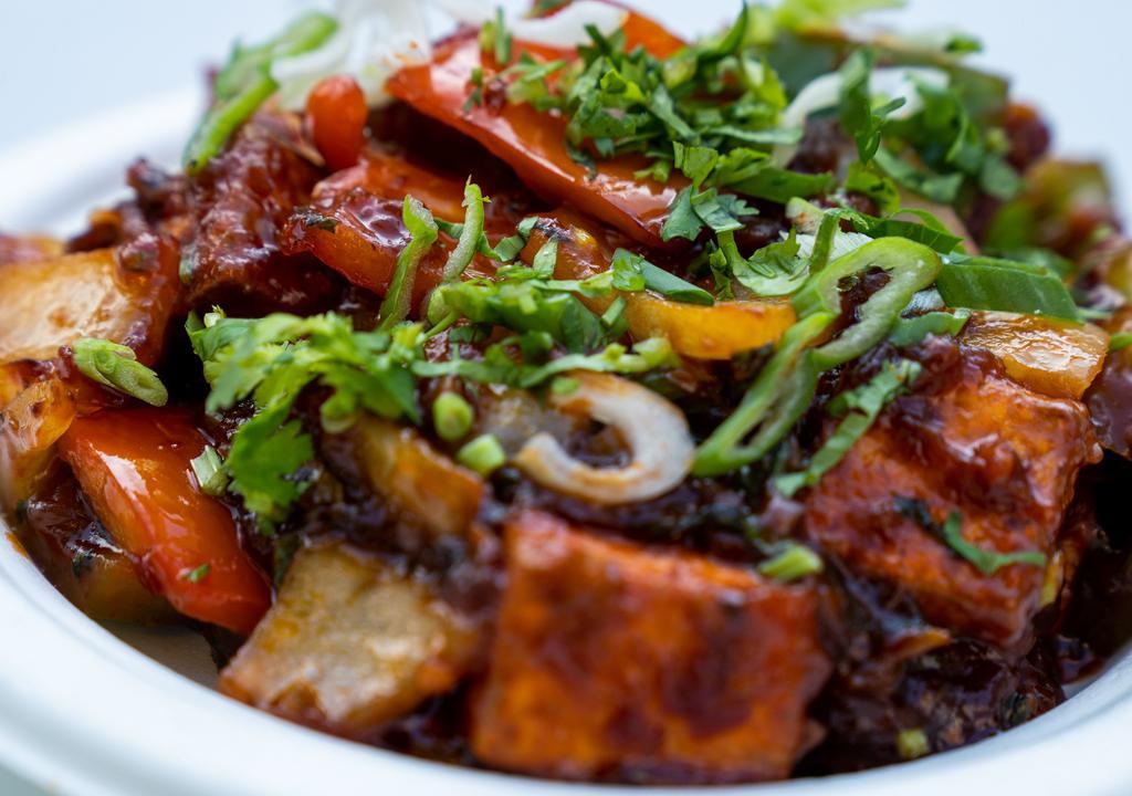 Chilli Paneer · Gluten-free. Paneer (Indian cottage cheese) tossed in a flavorful spicy sauce made with soy sauce, chili sauce, vinegar