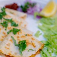 Pav Bhaji Quesadilla  · Indian street food icon with a Mexican twist. Flour tortilla stuffed with spiced mashed pota...