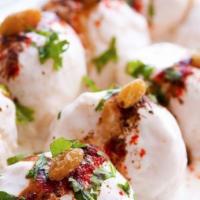 Dahi Vada · Gluten-free. Lentil fritters topped with yogurt and tamarind