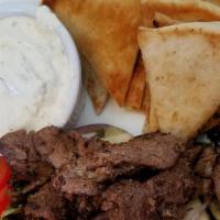 Lunch Mini Lamb Doner Platter · Served with Greek salad and your choice of side.