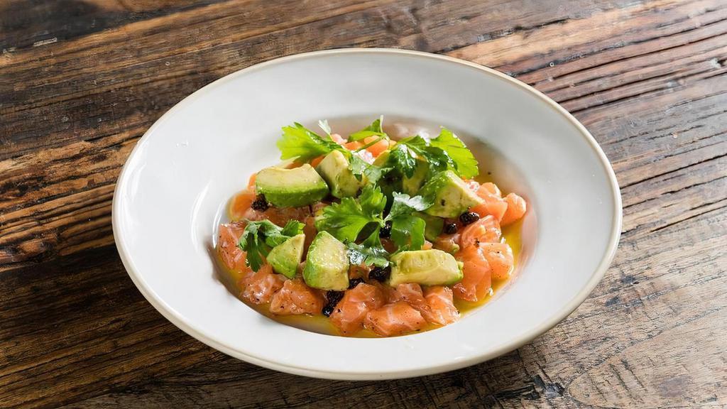 Tartare Di Salmone* · organic salmon tartare, avocado, fried capers, Dijon vinaigrette.  *Consuming raw or under-cooked meats, poultry, seafood, shellfish or eggs may increase your risk of foodborne illness.
