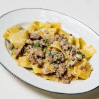 Pappardelle Con Salsiccia · sweet Italian sausage, braised endive, porcini mushrooms, herbs, truffle sauce
