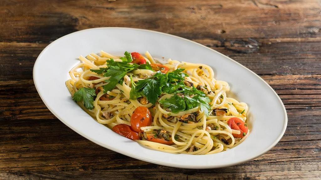 Linguine Alla Viareggina* · fresh Manila clams, P.E.I. mussels, white wine sauce, garlic, fresh parsley, crushed cherry tomatoes, pepperoncino. *Consuming raw or under-cooked meats, poultry, seafood, shellfish or eggs may increase your risk of foodborne illness.
