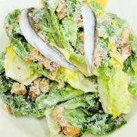 Little Gem Caesar Salad · 660cals. little gem lettuce, garlic croutons, parmesan cheese crisp, white anchovy