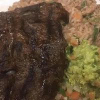 Churrasco Traditional · Grilled skirt steak, guacamole and (mix rice and beans) casserole with rice and beans.