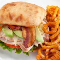 California Club Sandwich · Smoked turkey breast jack cheese bacon sliced avocado toasted ciabatta bun; lettuce tomato.