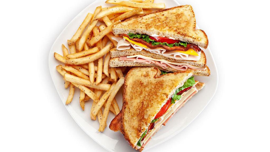 Triple Decker Club Sandwich · Ham, smoked turkey breast, bacon, American and Swiss cheeses, toasted wheat bread, lettuce, tomato, mayo. 970 calories.