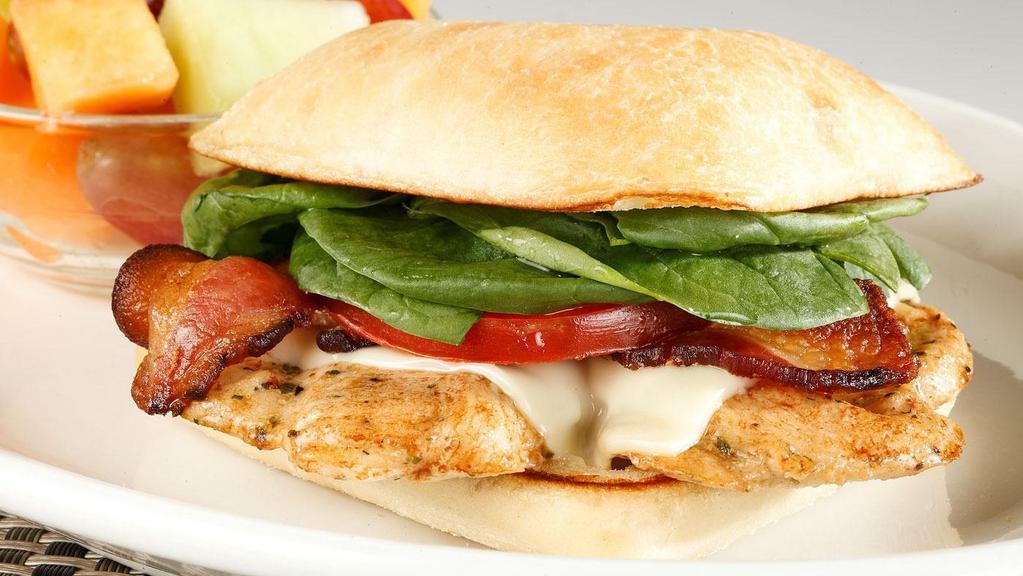 Chicken Club Sandwich · Grilled chicken breast swiss cheese bacon tomato fresh spinach toasted ciabatta bun.