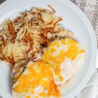 Country Benedict · Sliced buttermilk biscuit sausage patties over-medium eggs country sausage gravy and cheddar...