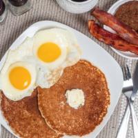 Ultimate Pancake Combo · 2 pancakes 2 eggs 2 bacon strips and 1 sausage patty. multigrain flaxseed pancakes for an ad...
