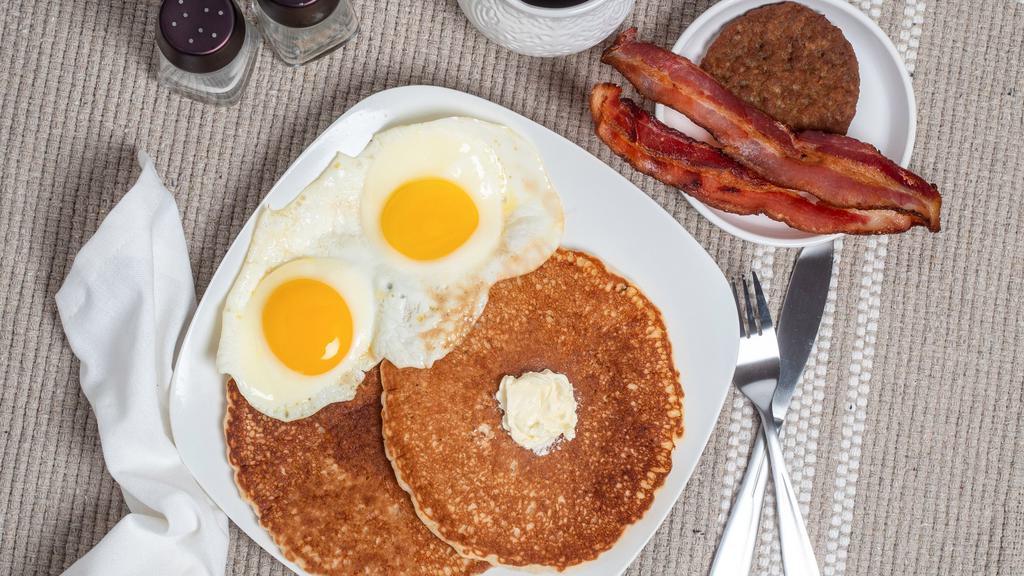 Ultimate Pancake Combo · 2 pancakes 2 eggs 2 bacon strips and 1 sausage patty. multigrain flaxseed pancakes for an additional charge.