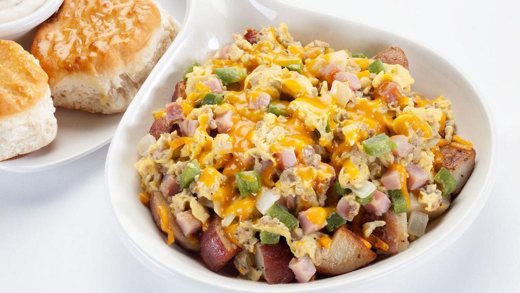 Farmers Skillet · Seasoned home fries ham crumbled sausage onions bell peppers; topped with cheddar cheese.