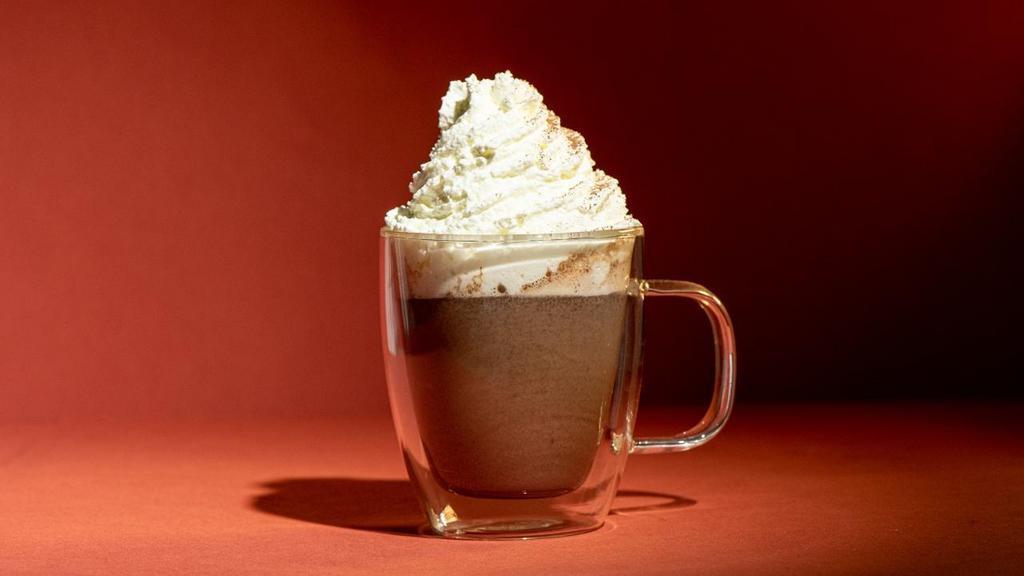 Hot Chocolate · Dark Cocoa blended with warm milk topped with vanilla whipped cream.