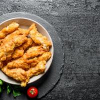Classic Chicken Tenders · Mouthwatering chicken tenders battered and fried to perfection.