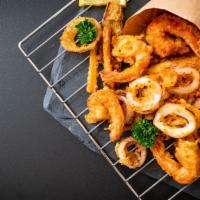 Fried Shrimp & Onion Rings · Hot N' Fresh Fried Shrimp, served on a bed of onion rings.