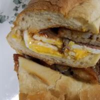 Belly Buster(Heart Attack) · Pork roll, Bacon, Sausage, Hash brown, Eggs and American cheese on a 1/2 sub.