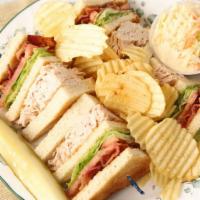 Turkey Club · Tripple decker with your choice toast white,wheat or rye. inlcudes pickles and chips.