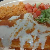 Enchiladas Mexicanas · Gluten free. Three enchiladas, one spinach cream, one cheese and one refried beans. Topped w...