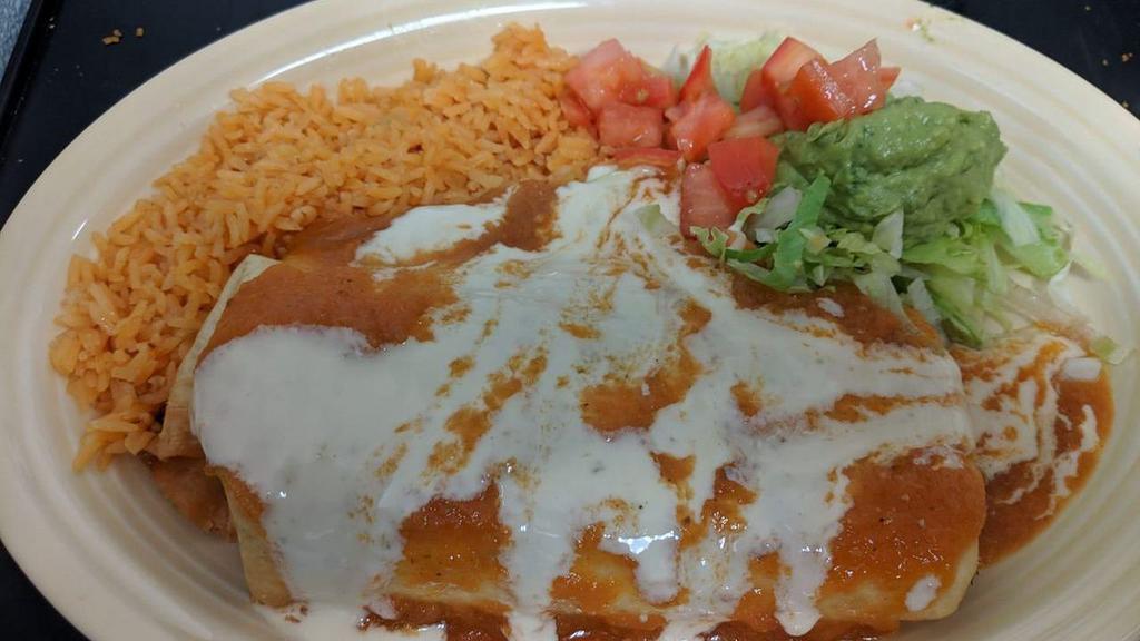 Enchiladas Mexicanas · Gluten free. Three enchiladas, one spinach cream, one cheese and one refried beans. Topped with lettuce, sour cream, tomatoes, shredded cheese and ranchero sauce. Served with Mexican rice.