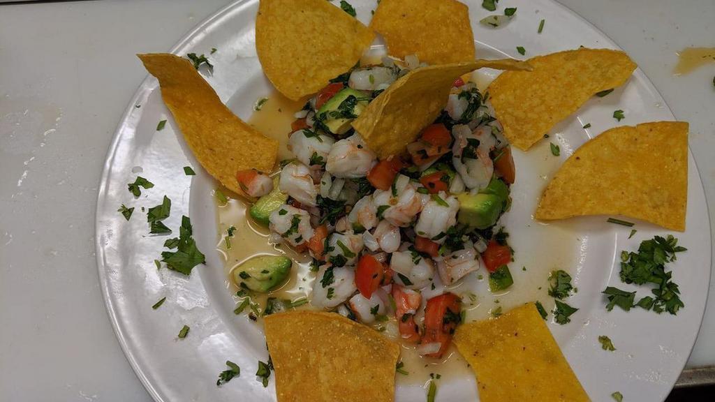 Ceviche · Gluten free. Chunks of fish marinated in citrus juices, seasoned with onions, cilantro, avocado and tomatoes. Accompanied with tortilla chips.