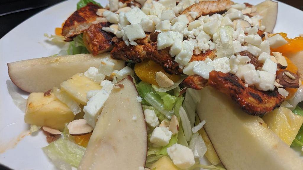 Tropical Salad · Fresh romaine and iceberg mix, apples, mandarin, pineapple, queso fresco and sliced almonds. Served with our special mango chipotle dressing.
