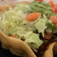 Fajita Taco Salad · Our delicious taco salad served with fajita-style chicken or steak with grilled bell peppers...