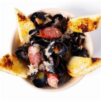 *Drunk German Mussels* · Our famous mussels made with german beer, kielbasa, and sauerkraut. Served with garlic bread.