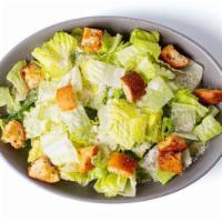 *Classic Caesar* · Baby romaine tossed in classic Caesar dressing, topped with garlic and herb croutons and gra...