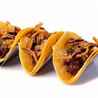 *Marinated Steak Tacos* · Marinated steak topped with fried onions, gorgonzola cheese and bacon onion jam. Drizzled wi...