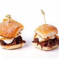*Short Rib Sliders* · Slow braised short rib topped with mozzarella cheese, a creamy horseradish sauce and frizzle...